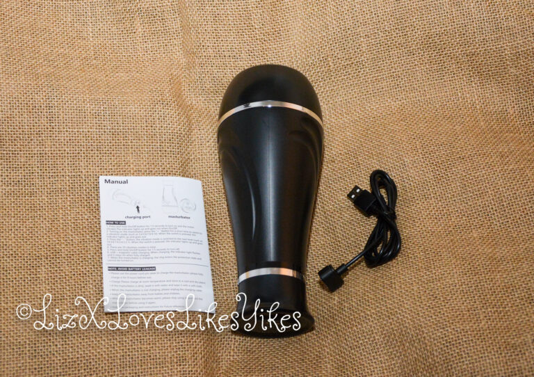 BestVibe Review of Vibrating Double Labia Male Masturbator The full masturbator is shown here with the cable and manual. Copyright Liz BlackX